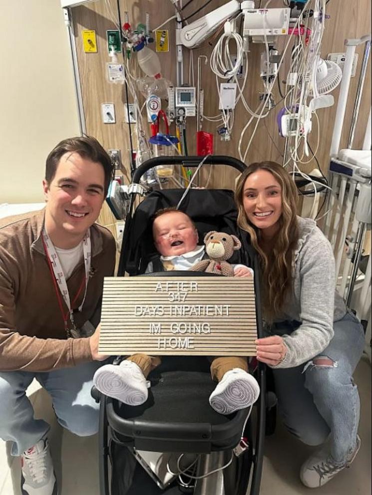 PHOTO: Faith and David Helmerich pose with their son Parker when he was discharged after nearly one year in the hospital.