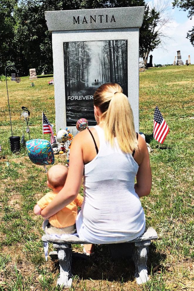 PHOTO: Destiny Klimaszewski is seen with her son, Cohen, now 2, as she visits the gravesite of her son Parker and late husband, Corey Mantia, who both died in an alcohol-related crash in 2014. 