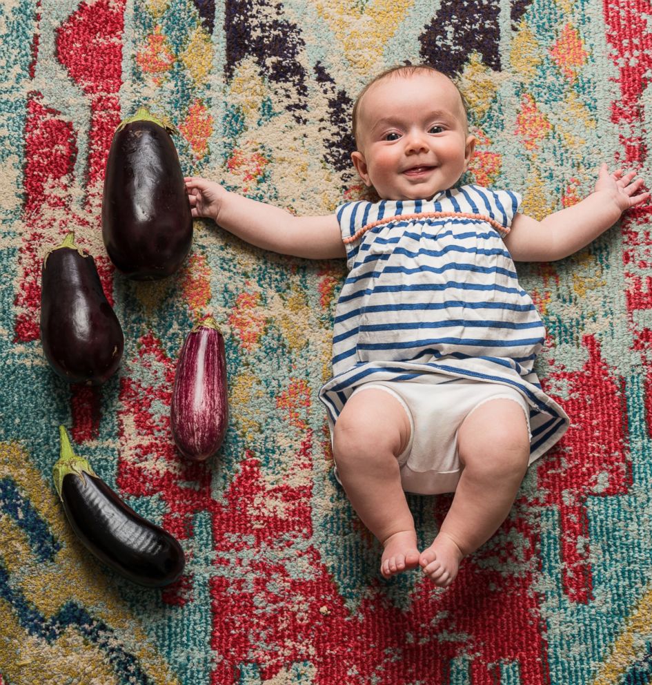 PHOTO: Michaela Claire Meter at four months old with four eggplants.
