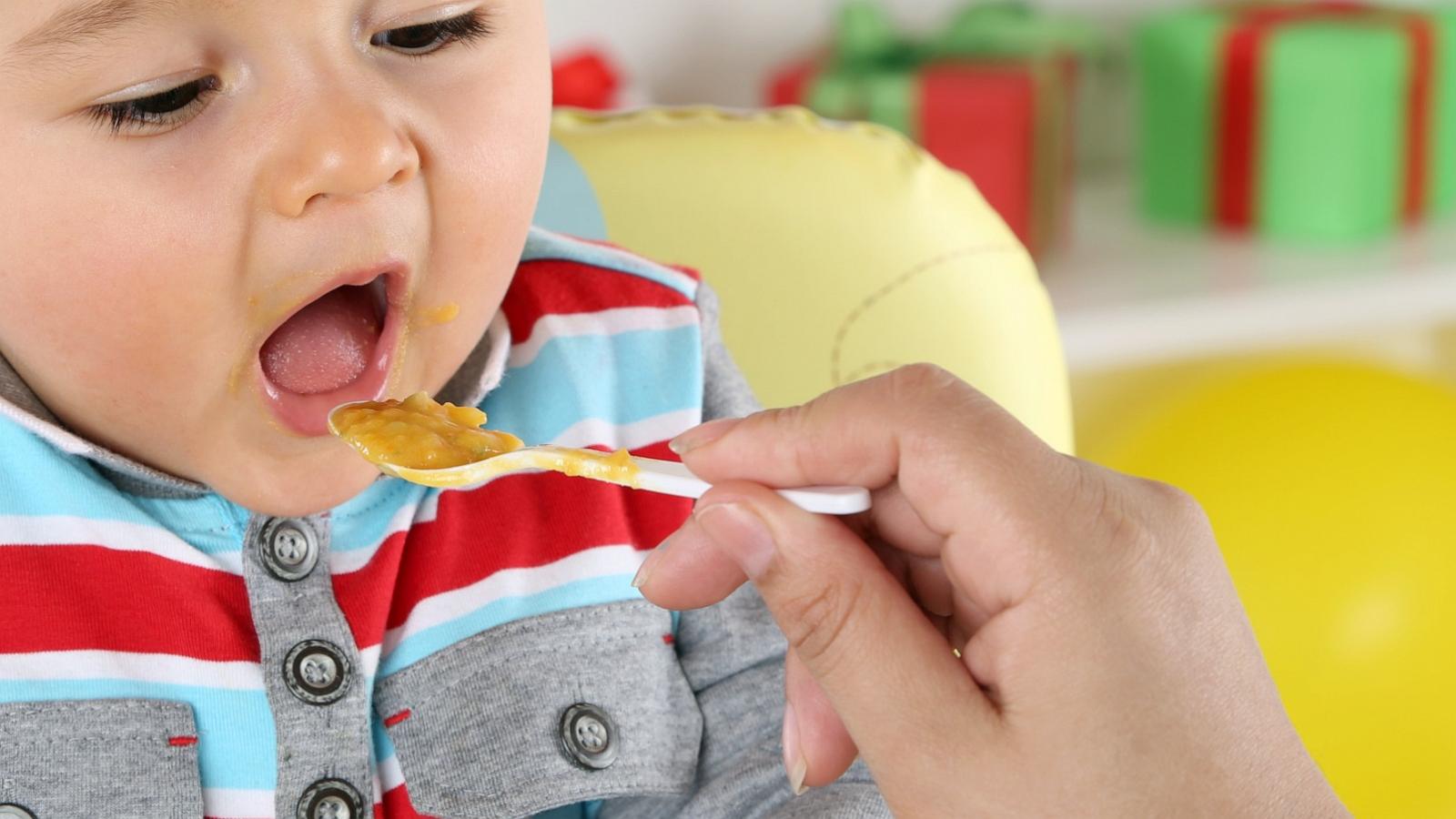 PHOTO: Baby eating peanut butter.