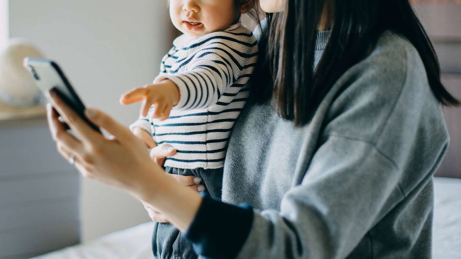 PHOTO: A mother and daughter use a smartphone in this undated stock photo.