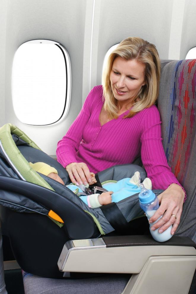 PHOTO: Mother and Baby Sitting in Airplane Seats