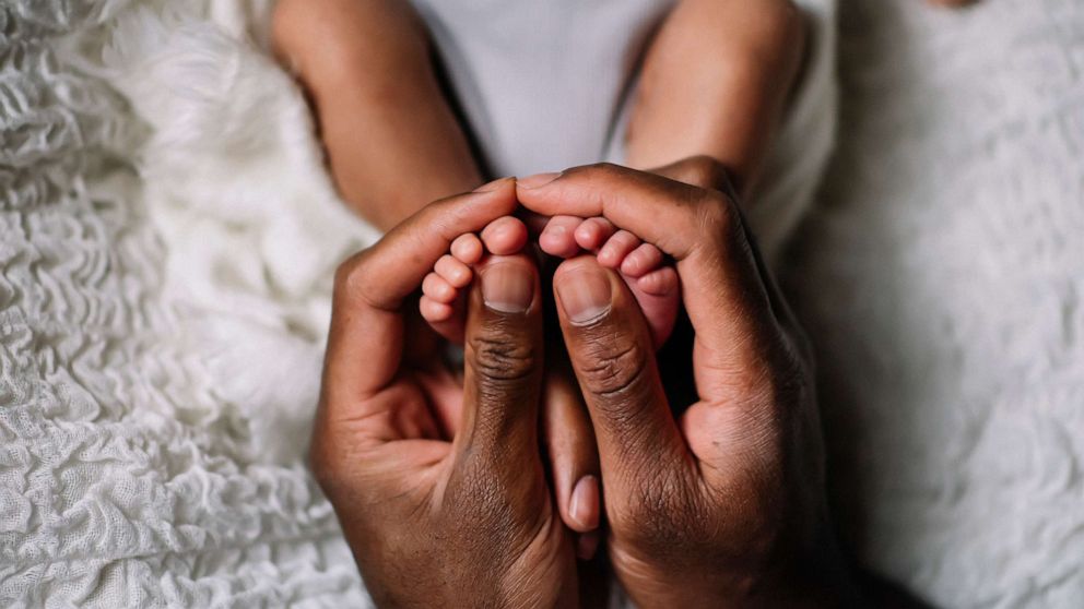 Close Up Of Mother Spoon Feeding Her Baby High-Res Stock Photo - Getty  Images