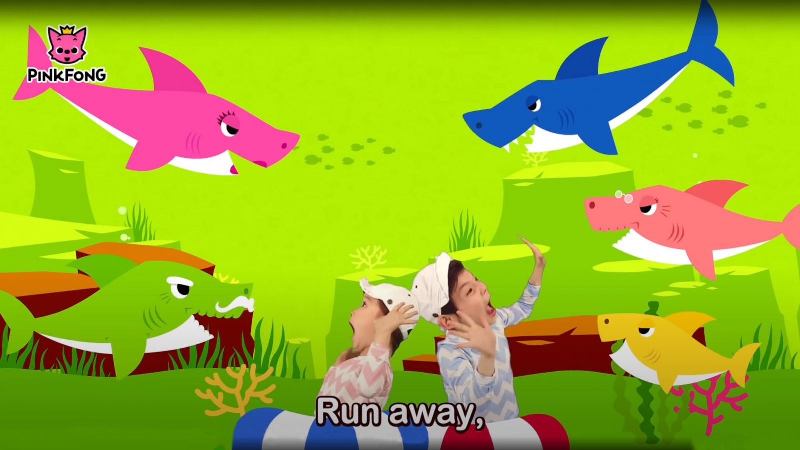 PHOTO: Children surrounded by cartoon sharks are pictured in a still image taken from the video "Baby Shark Dance" posted on the "Baby Shark" official YouTube channel.