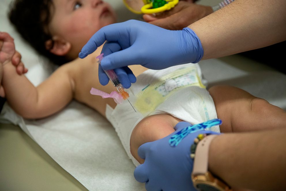 PHOTO: Certified Medical Assistant Angela Dolezil gives a flu vaccine to a 6-month-old on Feb. 12, 2019, at Amita/Presence Health clinic in Chicago.