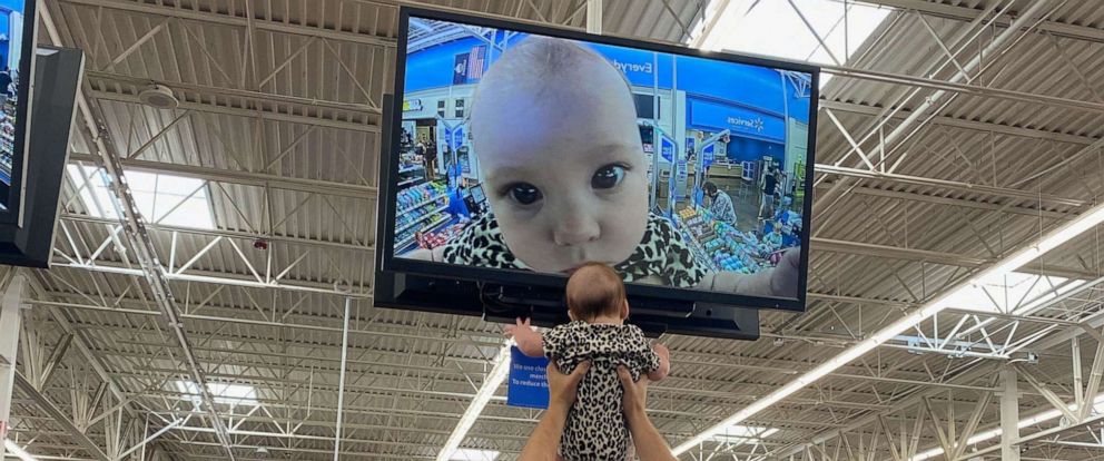 PHOTO: Mom Ivy Janzen captured the moment when her husband Nick Janzen lifted their 5-month-old, Kira, up to the television monitor in the Wichita, Kansas-based Walmart. The image of Kira was tweeted by on Oct. 15 and garnered viral attention.
