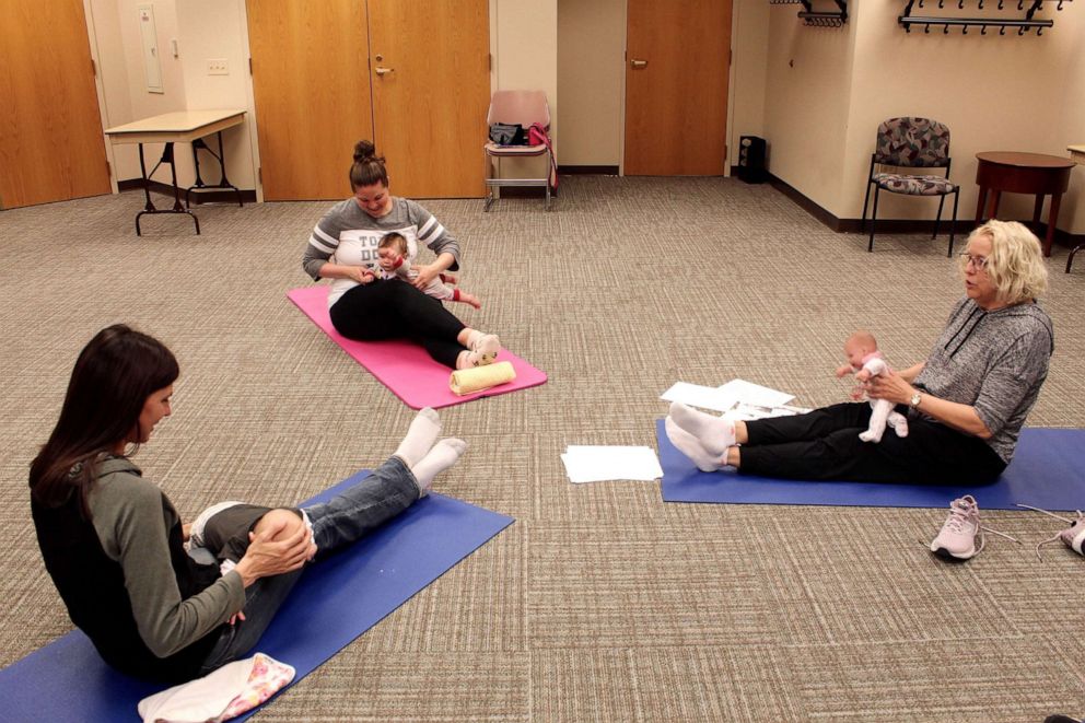 PHOTO: Patti Ideran, far right, leads a baby yoga class at Northwestern Medicine Central DuPage Hospital.