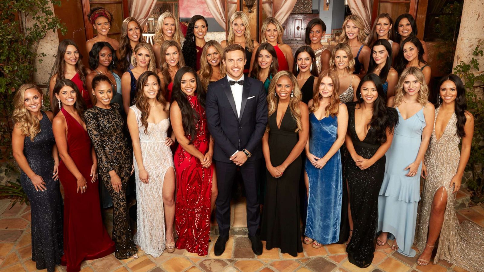 PHOTO: Airline pilot Peter Weber poses with the contestants from the 24th season of the ABC reality series, "The Bachelor," premiering on Jan. 6, 2020.