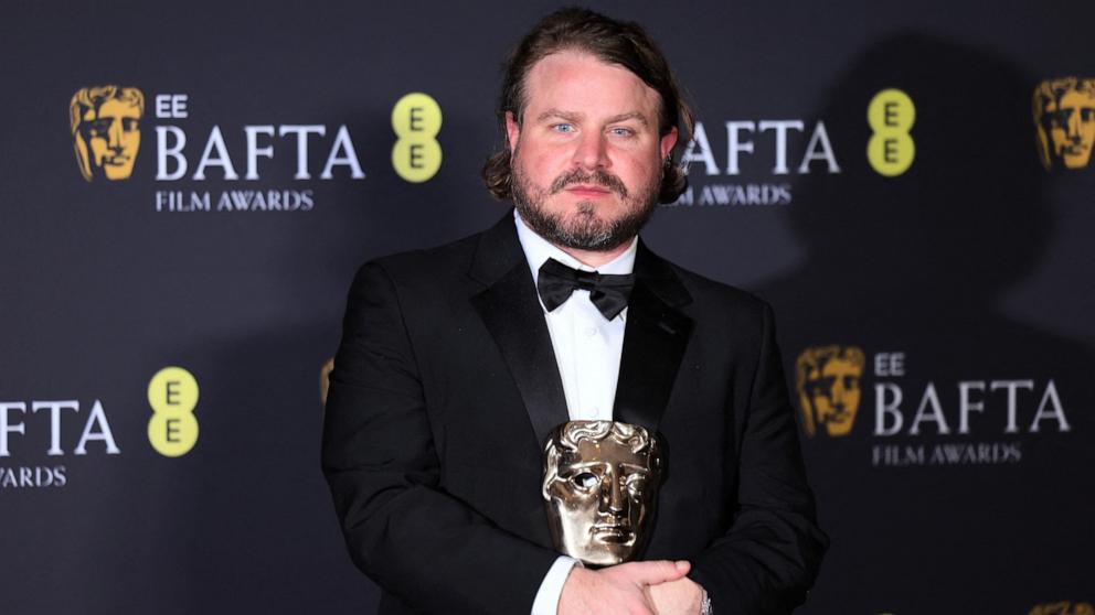 PHOTO: Director Brady Corbet poses with the Best Director award for "The Brutalist", during the 2025 British Academy of Film and Television Awards at the Royal Festival Hall in the Southbank Centre, London, Feb. 16, 2025. 