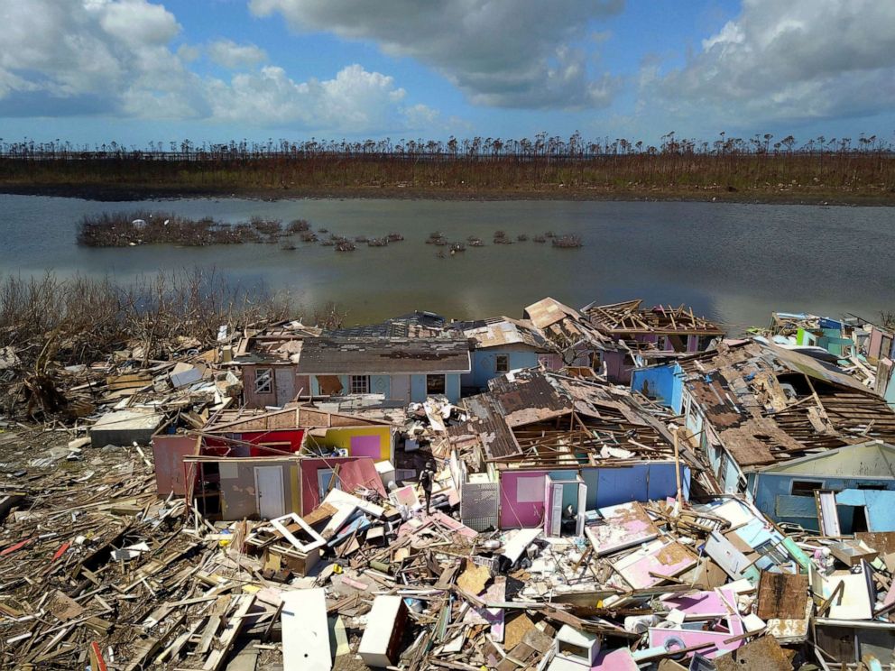 PHOTO: A Haitian migrant walks among the ruins of a neighborhood destroyed by Hurricane Dorian in Sandbank, Abaco, Bahamas, Sept. 28, 2019.