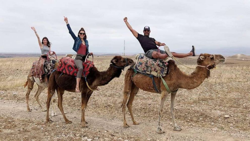 PHOTO: Bailey Matheson, center, rides a camel in Morocco with her boyfriend Brent Andrews and her friend Julie Carrigan.