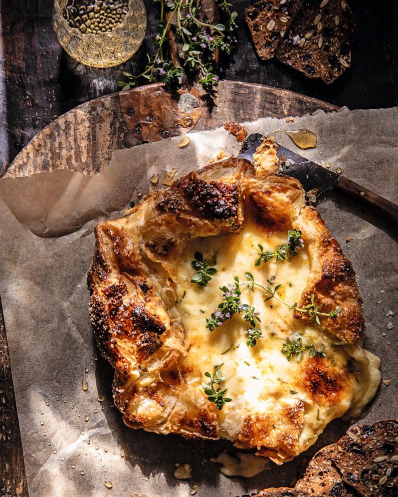 PHOTO: A baked brie with honey and herbs.