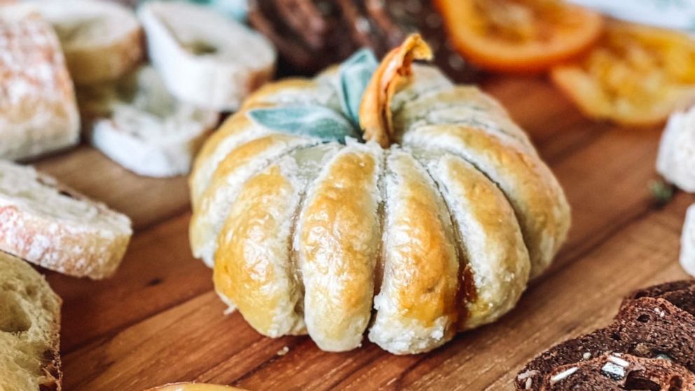 PHOTO: A baked brie en croute in the shape of a pumpkin.