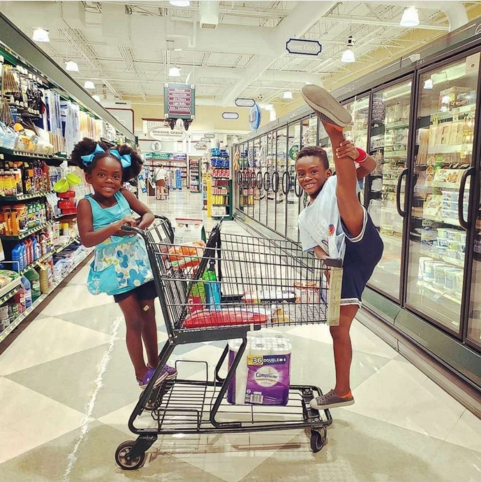 PHOTO: Maximus Turner, 8, and Liliana, 6, pose while shopping at a grocery store. Maximus Turner choreographed an at-home ballet recital for himself and his sister during the coronavirus pandemic.
