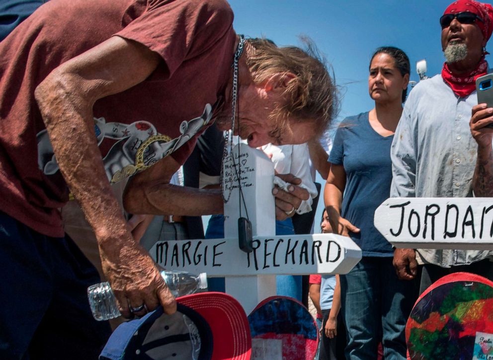 PHOTO: Antonio Basco kisses the cross with the name of his common-law wife Margie Reckard who died in the El Paso mass shooting, Aug. 5, 2019.