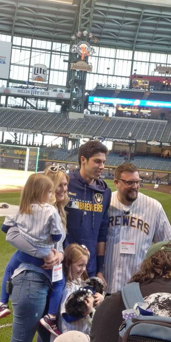 PHOTO: Christian Yelich, an outfielder for the Milwaukee Brewers, surprised Lola Labodda, 6, her sister Libby Labodda, 4 and parents Mike and Jessica Labodda, with an 11-week old mini golden doodle named Yeli.