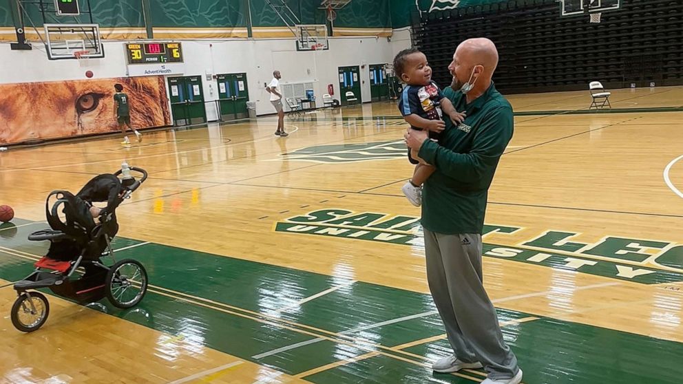 PHOTO: Aiden Webster attends practice for the Saint Leo University basketball team, for which his mom Ashley Webster is an assistant coach.
