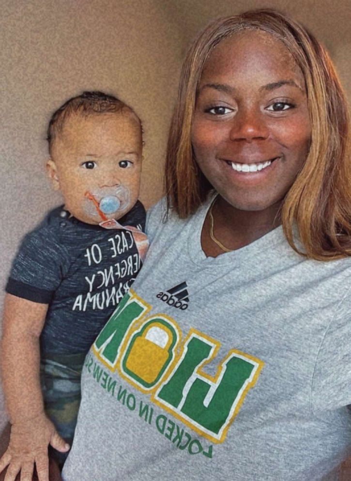 PHOTO: Ashley Webster, an assistant basketball coach at Saint Leo University, holds her son, Aiden.
