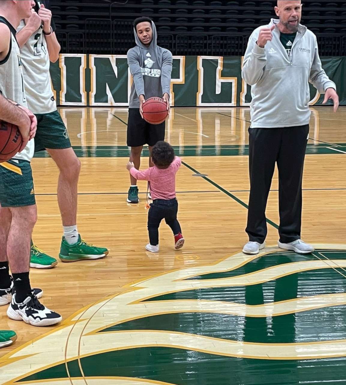 PHOTO: Aiden Webster attends practice for the Saint Leo University basketball team, for which his mom Ashley Webster is an assistant coach.