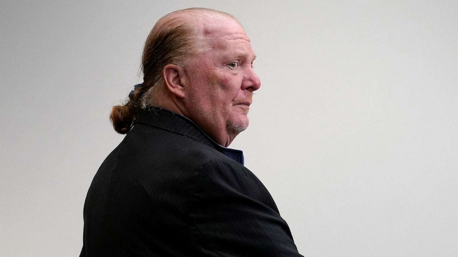 PHOTO: Celebrity chef Mario Batali stands in a court room during the first day of his trial on a criminal charge that he forcibly groped and kissed a woman at a restaurant in 2017, at the Boston Municipal Court in Boston, May 9, 2022.