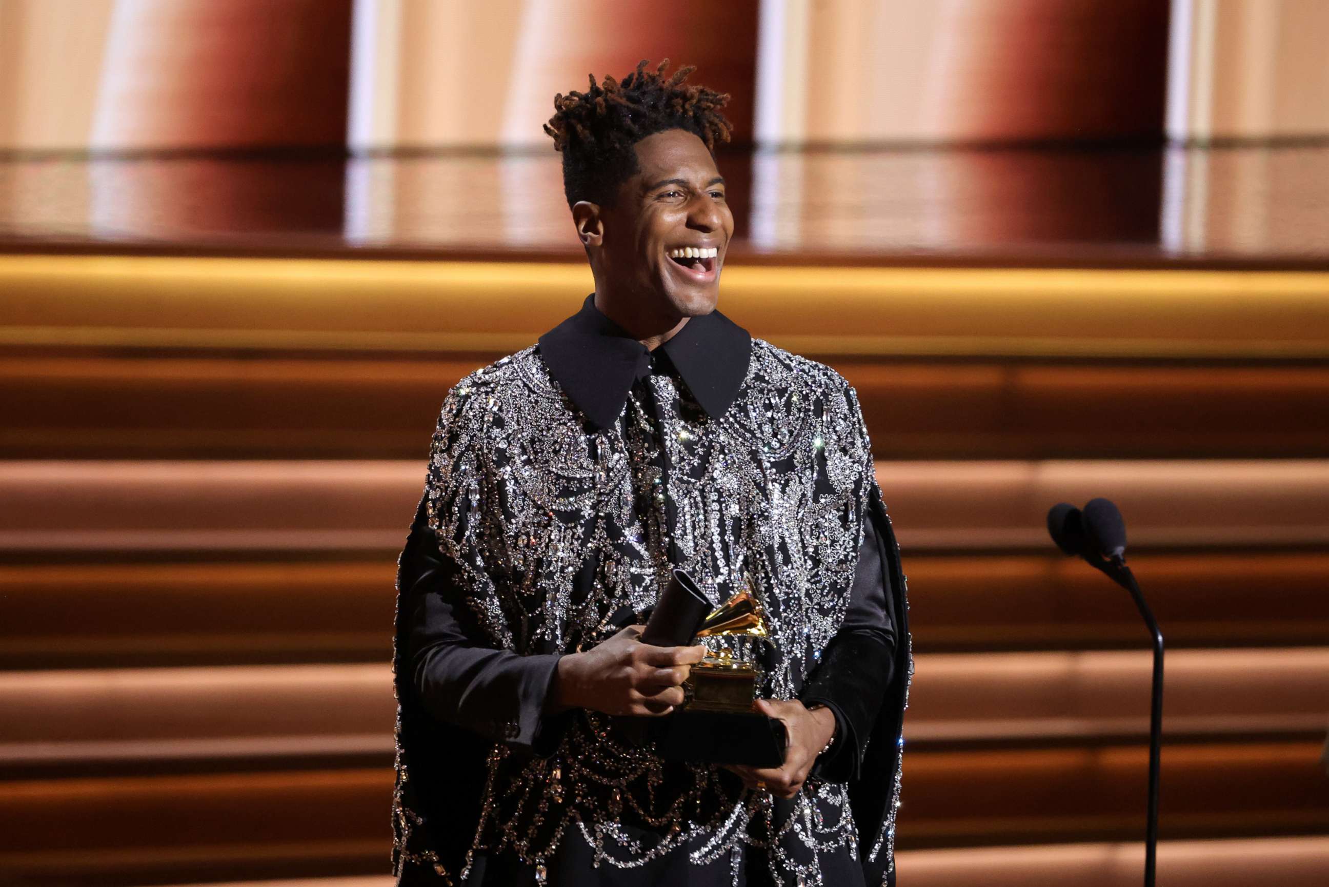 PHOTO: Jon Batiste accepts the Album of the Year award onstage during the 64th GRAMMY Awards at MGM Grand Garden Arena, April 3, 2022, in Las Vegas.