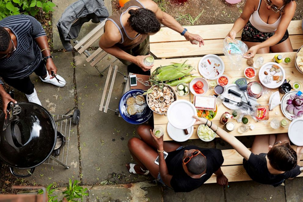 PHOTO: Stock photo of people enjoying a barbecue at home.
