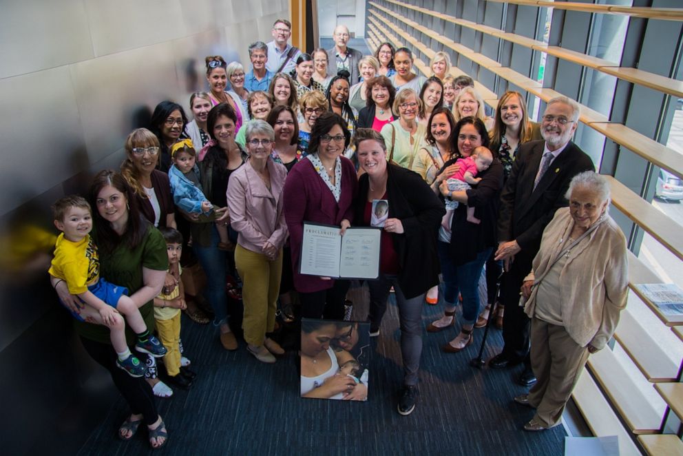 PHOTO: Rachel and Erin Alder, center, pose with supporters after passage of Bea's Law on June 3, 2019.