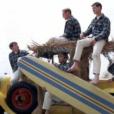 PHOTO: Rock and roll band "The Beach Boys" pose for a portrait with a vintage station wagon in August 1962 in Los Angeles.