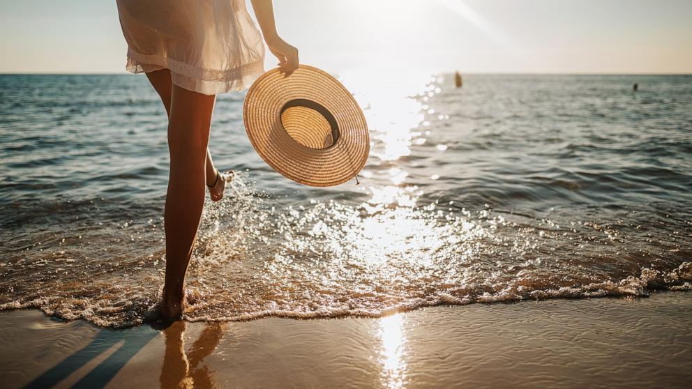 PHOTO: A woman walks on the beach in an undated stock photo. 