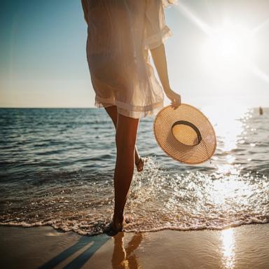 PHOTO: A woman walks on the beach in an undated stock photo. 