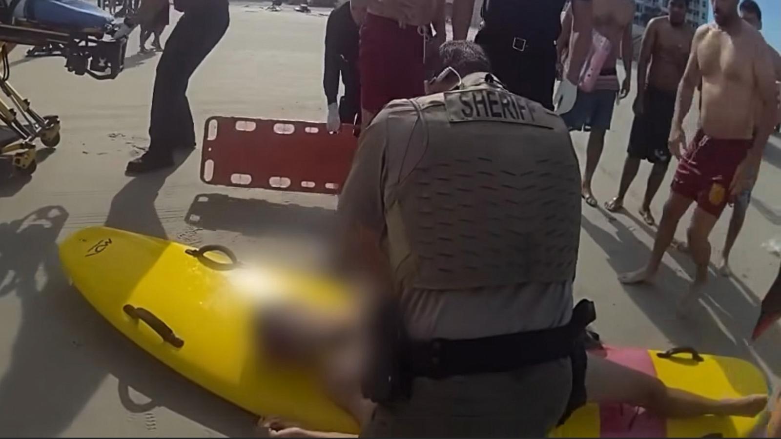 PHOTO: Bodycamera footage shows first responders rescuing Felipe Desouza from a rip current, March 30, 2024, off the coast of New Smyrna Beach, Fla.