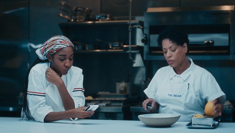 PHOTO: Ayo Edebiri as Sydney Adamu, Liza Colon-Zayas as Tina in "The Bear" - Season 4.