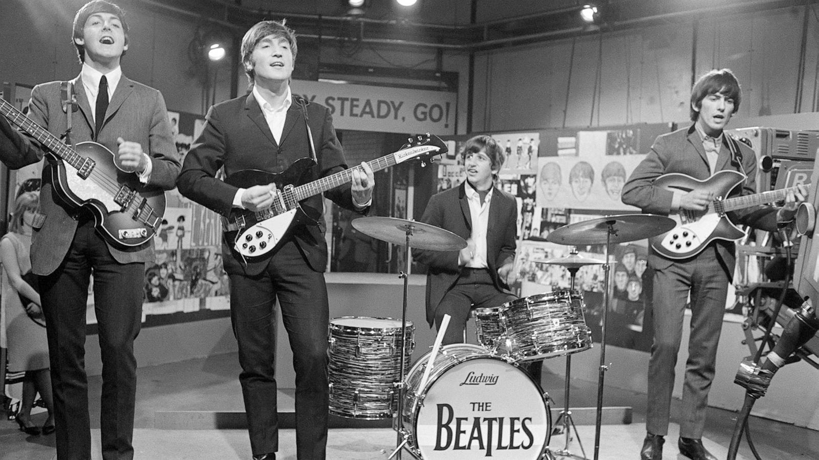 PHOTO: The Beatles at Television House, Kingsway, for an appearance on the television Show "Ready, Steady, Go" Left to right: Paul McCartney, John Lennon, Ringo Starr and George Harrison pictured playing on stage. March 20, 1964.