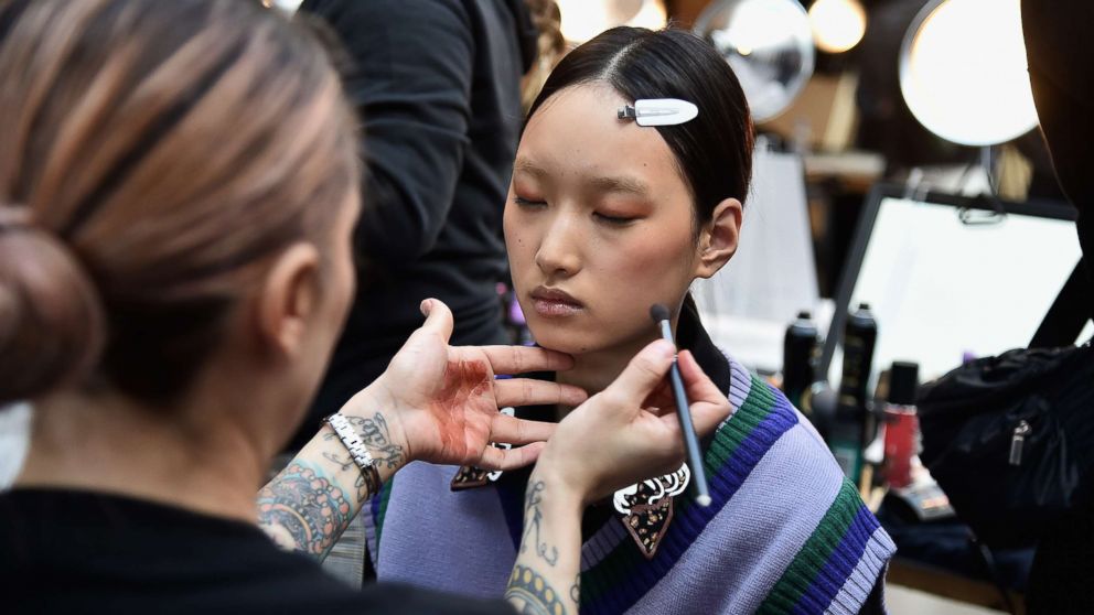 A model prepares backstage for a fashion show during New York Fashion Week, Feb. 8, 2019, in New York.