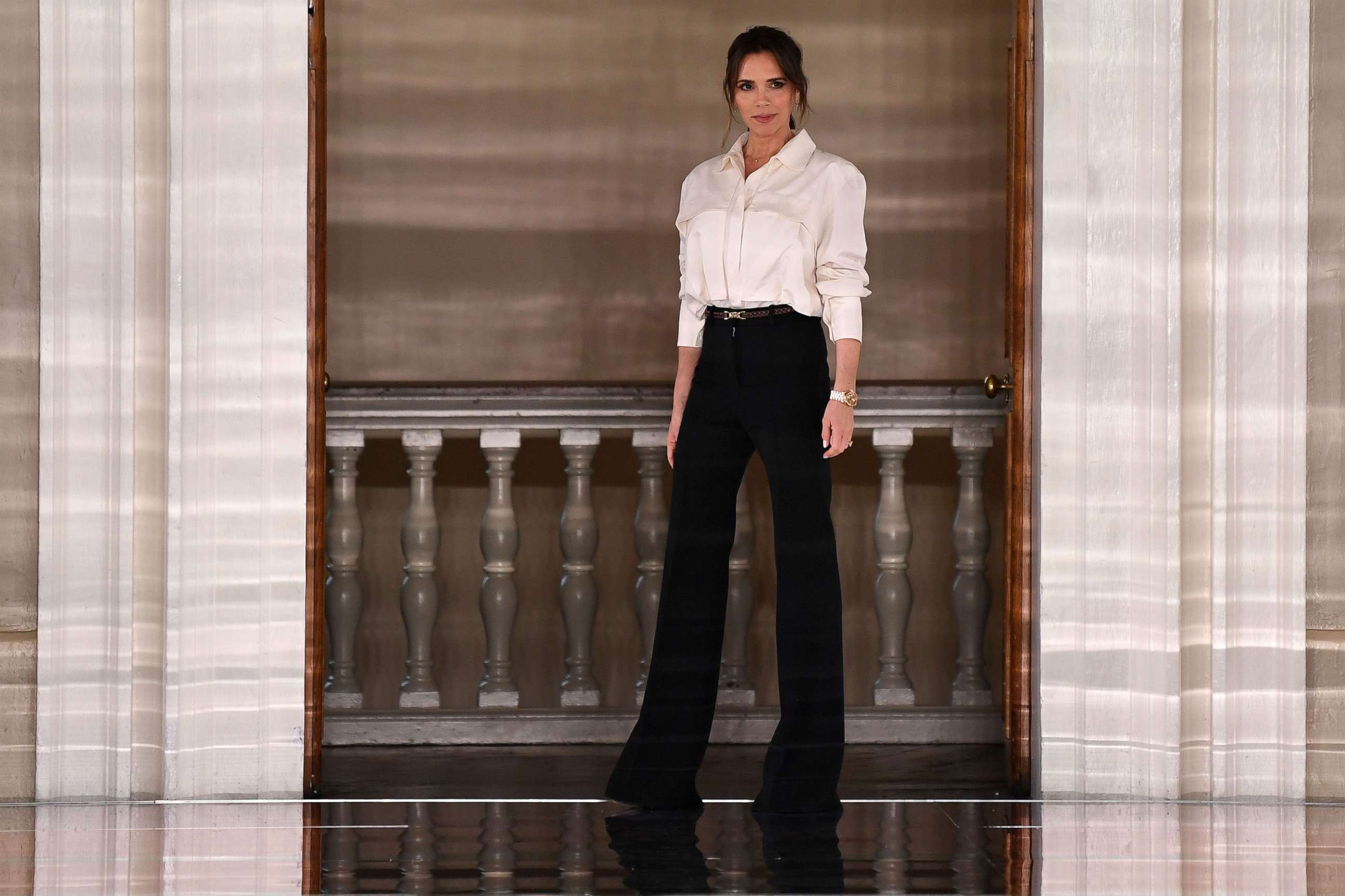 PHOTO: Victoria Beckham walks on stage after presenting her Autumn/Winter 2020 collection on the third day of London Fashion Week in London, Feb. 16, 2020. 