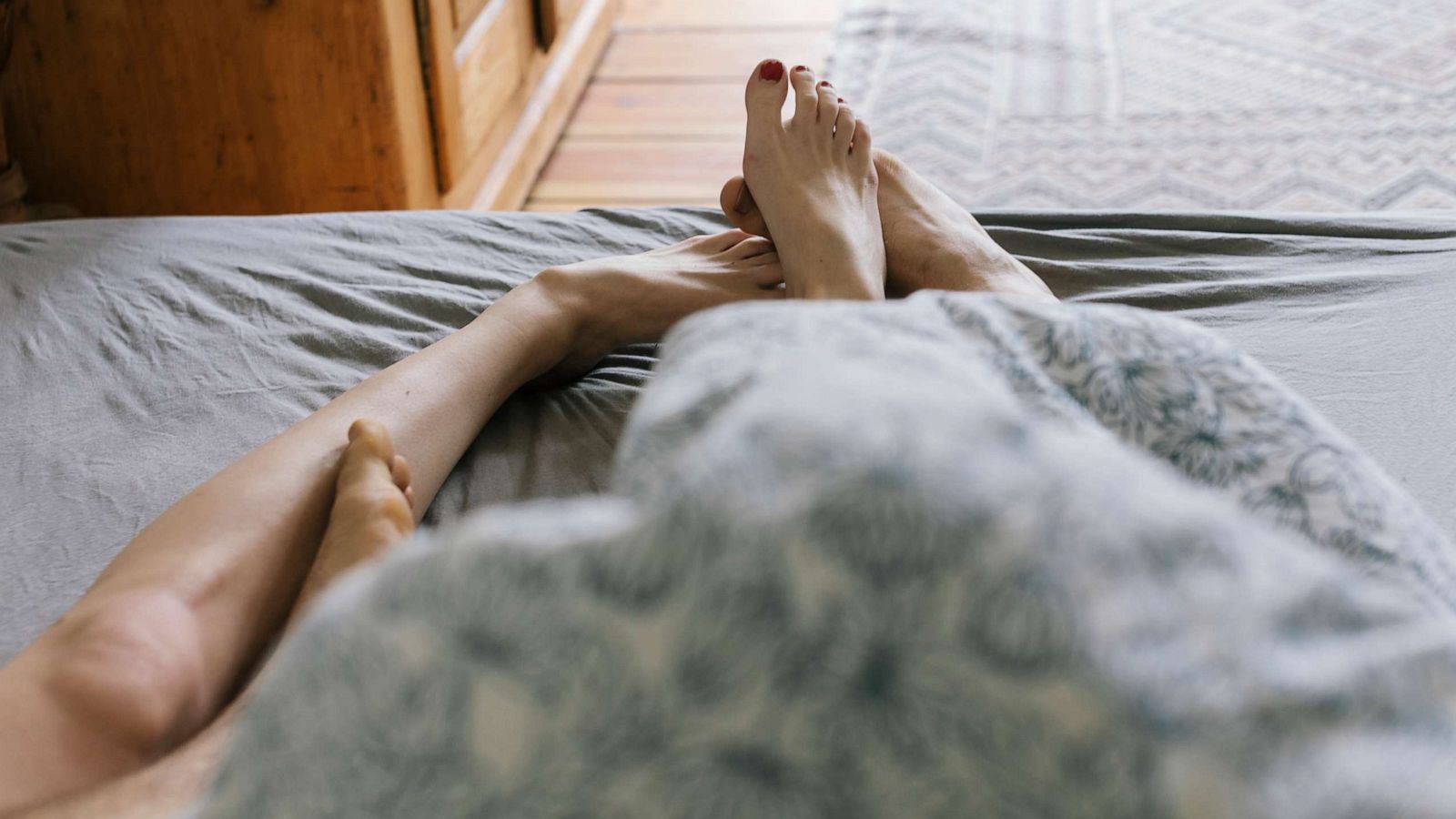 PHOTO: A couple lies in bed in this stock photo.