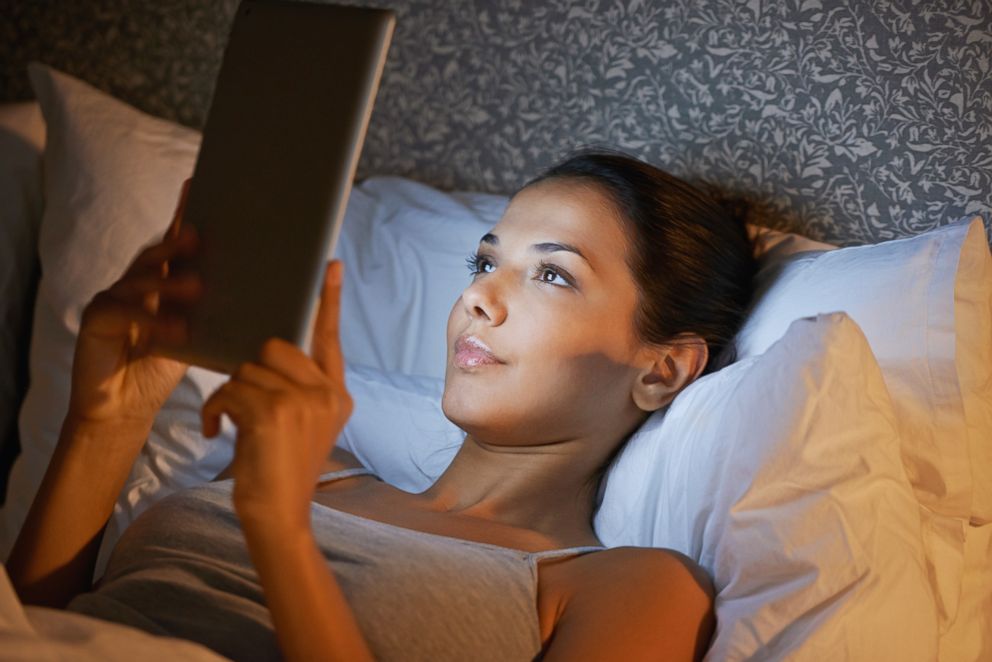 PHOTO: A woman reads before bed in this undated stock photo.