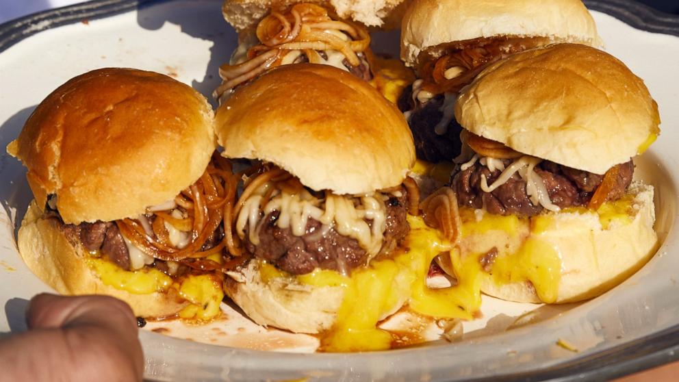 PHOTO: A plate of beef sliders with provolone and balsamic onions.