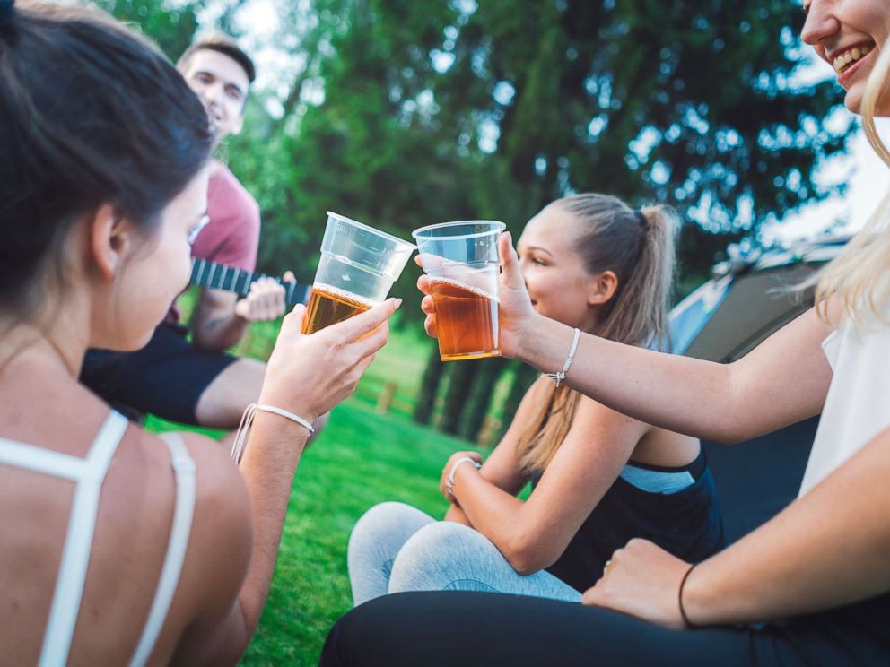 PHOTO: Young people drink beer outdoors in an undated stock photo.