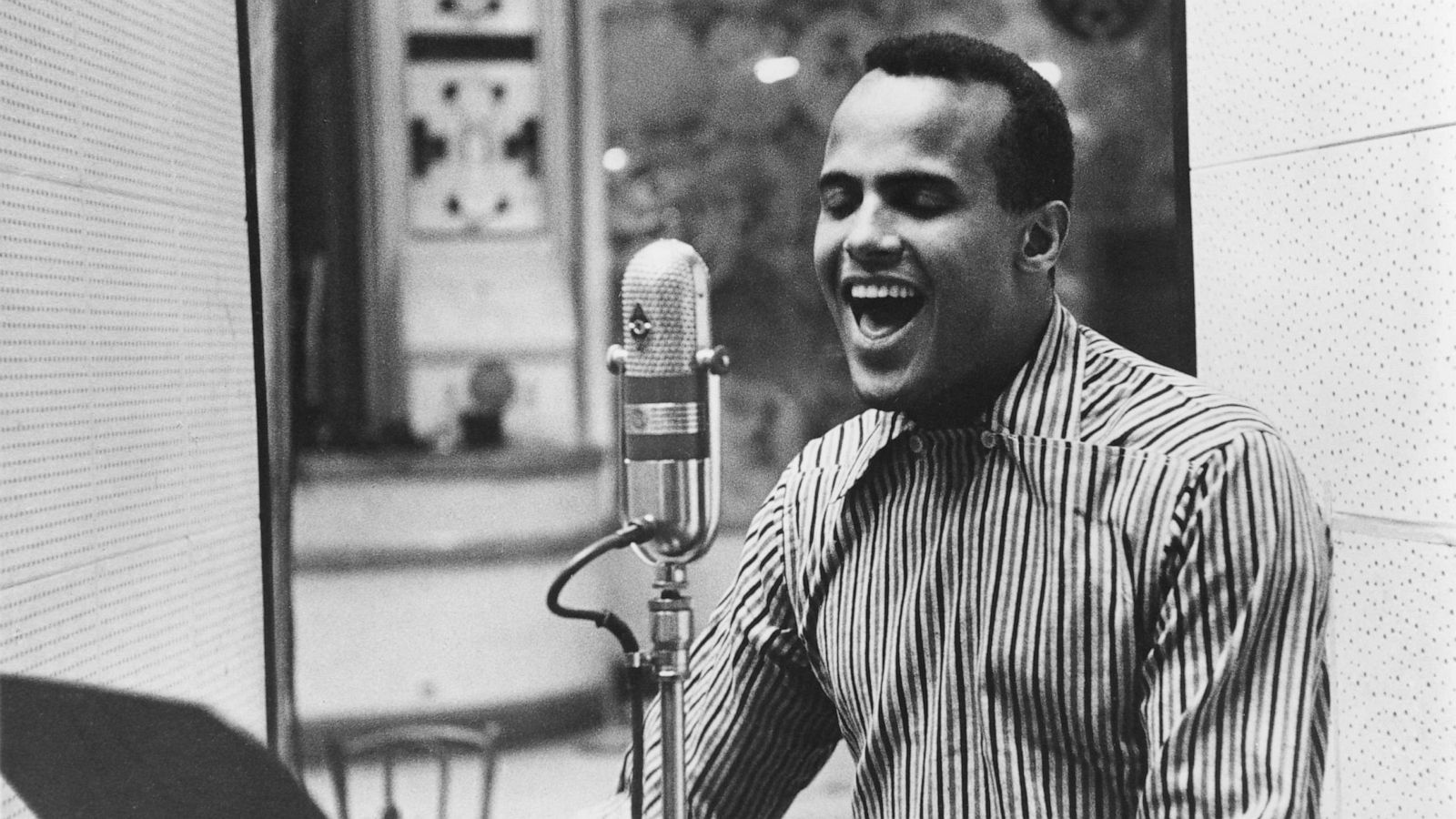 PHOTO: American singer Harry Belafonte performing in a recording studio, circa 1957.