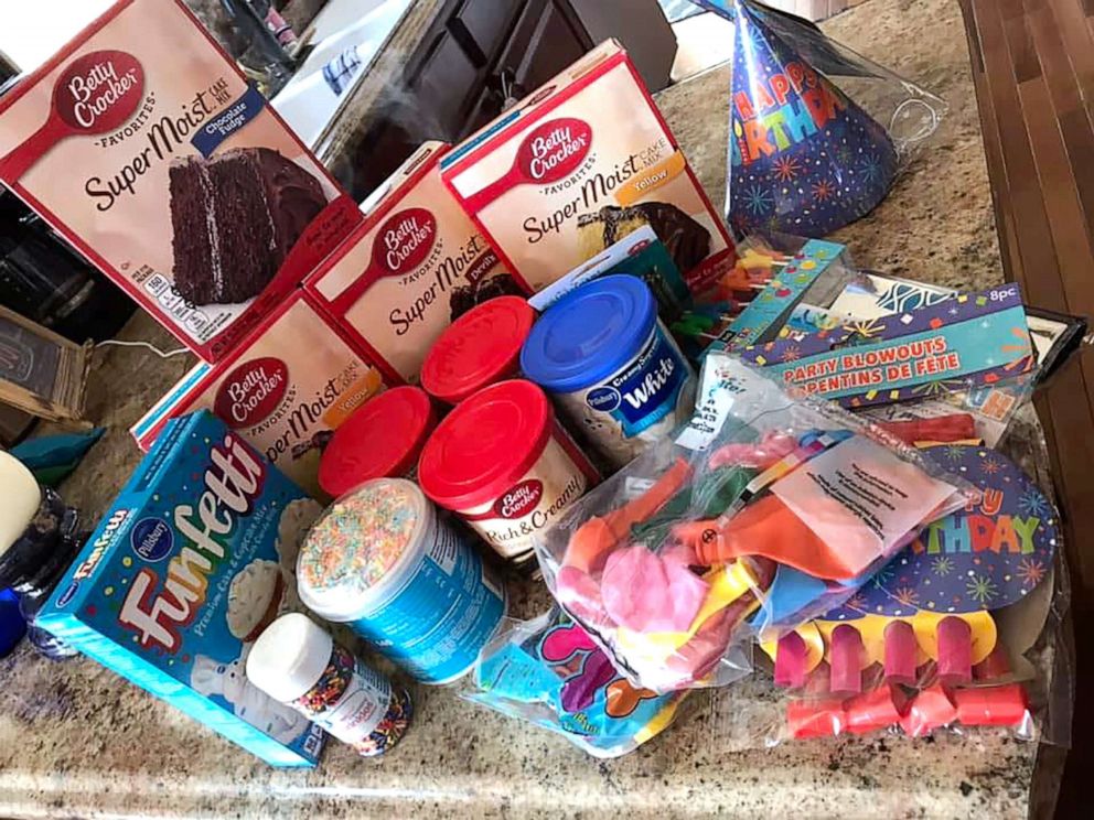 PHOTO: Bella accepts donations of balloons, cake mix and other party supplies and packs them up for her fellow students at Wyan-Pine Grove Elementary School in Ky.