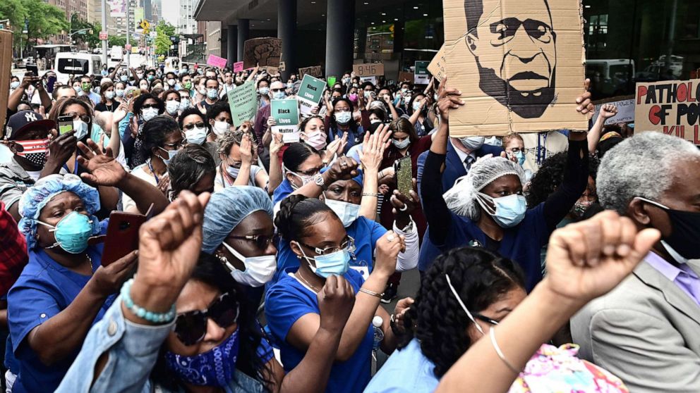 PHOTO: Nurses and healthcare workers attend a Black Lives Matter rally in front of Bellevue Hospital, June 4, 2020, in New York City.