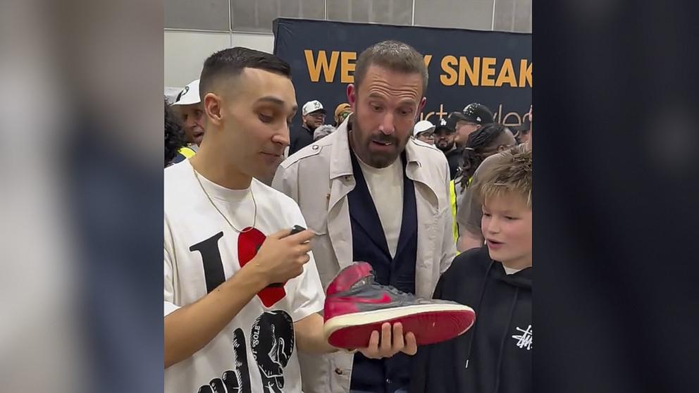 PHOTO: Ben Affleck appeared shocked when his son Samuel checked out a pair of $6,000 sneakers at a sneaker convention in Los Angeles on March 1.