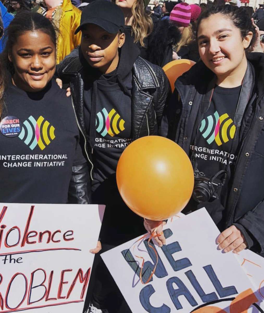 PHOTO: CUNY student Elisabeth Bernard, center, with some youth volunteers at an Intergenerational Change Initiative event.