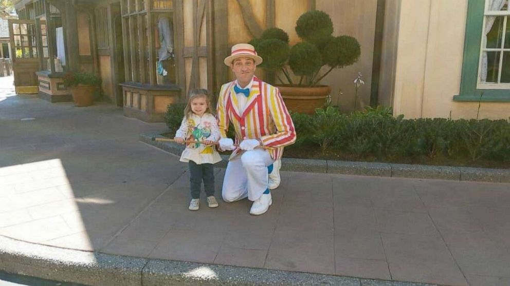 PHOTO: Marceline Raider, 2, is photographed with a Mary Poppins character at Disney World on March 6.