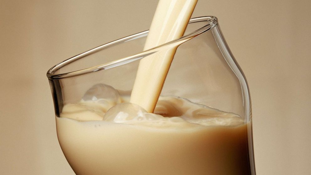 A stock photo of a beverage being poured into a glass.