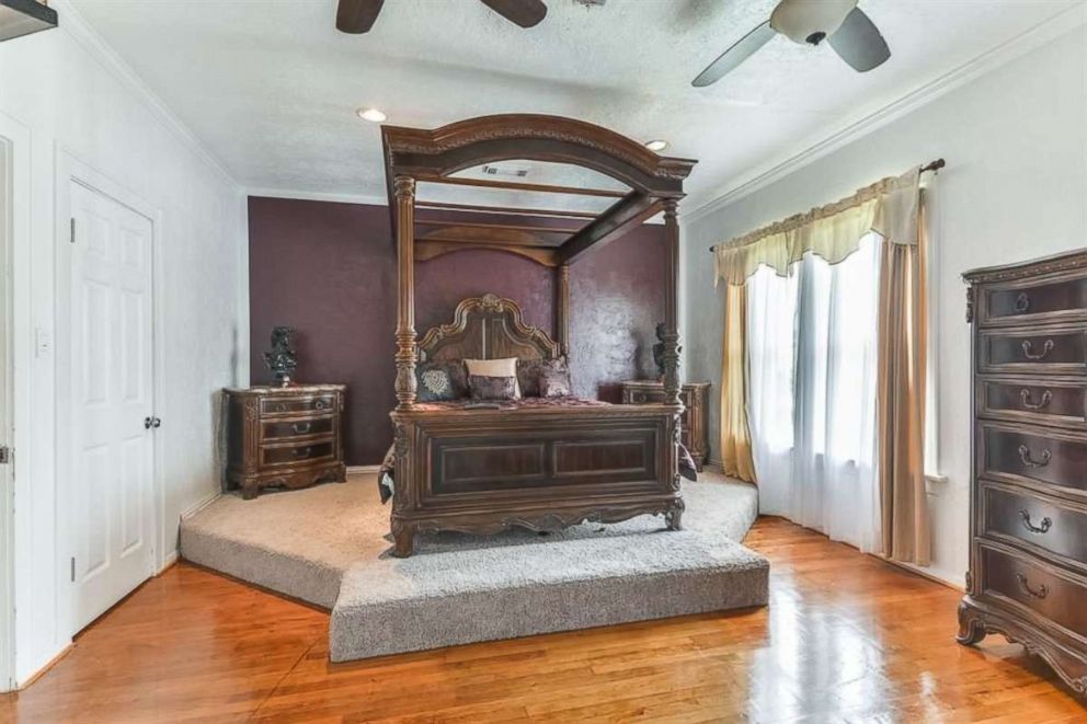 PHOTO: The former childhood home of Beyonce features a master bedroom with raised bed platform & spiral staircase to a third-floor loft.