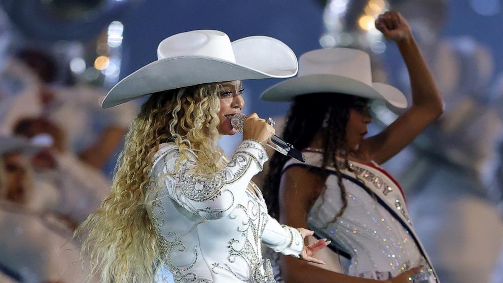 PHOTO: Beyonce performs with daughter, Blue Ivy, during the halftime show for the game between the Baltimore Ravens and the Houston Texans at NRG Stadium on December 25, 2024 in Houston, Texas.
