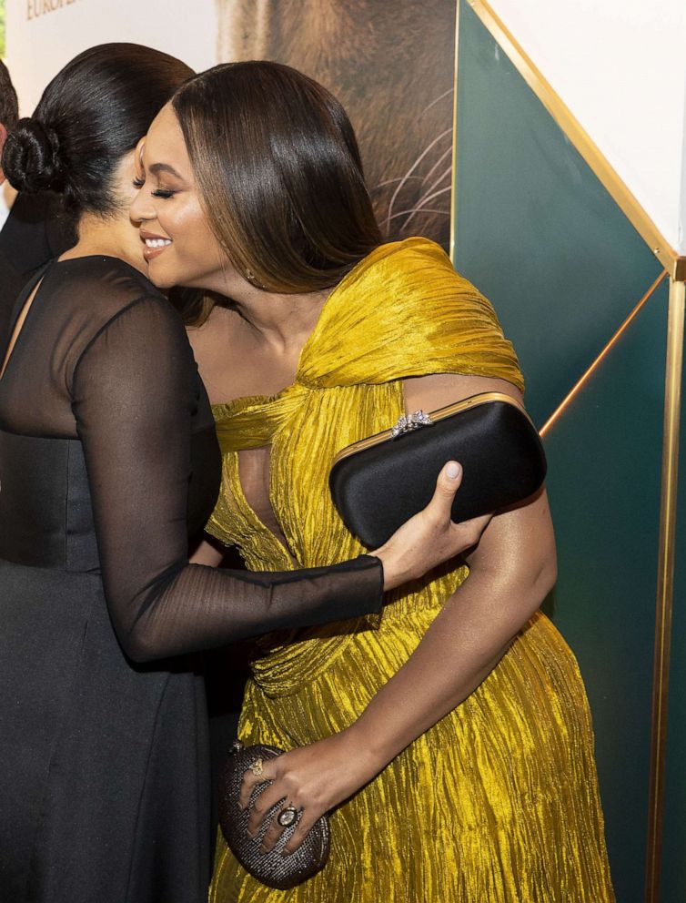 PHOTO: Britain's Meghan, Duchess of Sussex hugs singer-songwriter Beyonce Knowles as they attend the European premiere of the film The Lion King in London, July 14 2019.