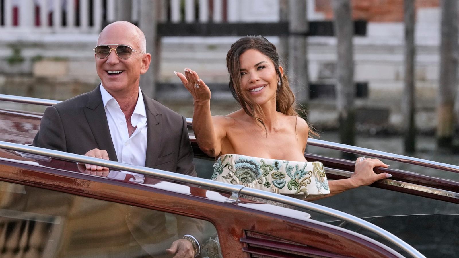 PHOTO: Jeff Bezos, left, and Lauren Sanchez leave a hotel for their pre-wedding reception, in Venice, Italy, June 26, 2025.